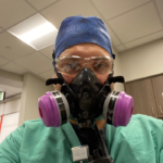 Nurse wearing a respirator